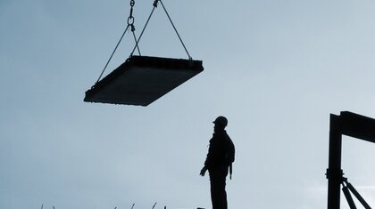 Lifted load and man